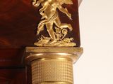 an antique clock with a gold statue on top of it