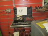 a small stove with a sign on it in a room