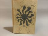a small box with a drawing of a flower on it