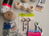 a table with a bunch of yarn, scissors and other items on it