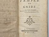 an open book with a picture of a temple on it