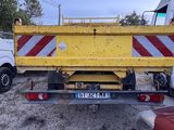a yellow dump truck that is parked in a lot