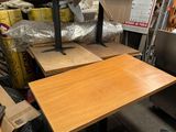 a table that is sitting in the middle of a pile of boxes