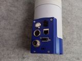 a blue and white device on the floor next to a blue and white object