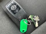 a car key that is sitting in the back seat of a car