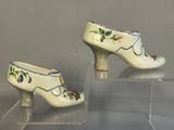 a pair of shoes that are on display in a glass case