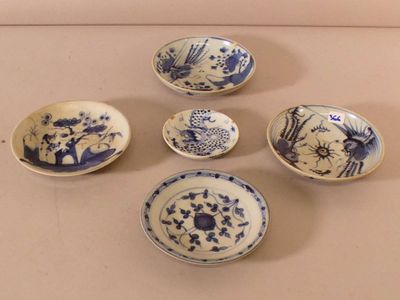 six blue and white bowls with designs on them sitting on a table