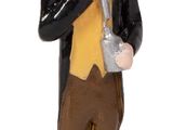 a figurine of a man in a tuxedo holding a glass