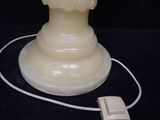 a lamp that is sitting on a table with a mouse on it
