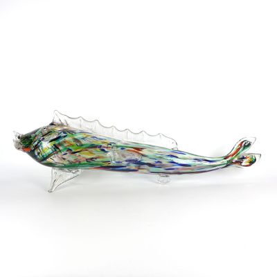 un poisson en verre posé sur une surface blanche