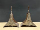 pair of antique brass bells with intricate design