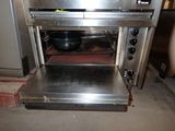 an image of a stainless steel oven with a pan in it