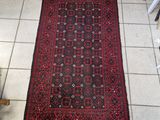 rug on the floor in a room with tile flooring and tile flooring