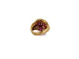 a close up of a gold ring with a pink stone