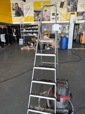 an image of a small industrial cleaning machine in a garage