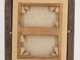 a close up of a wooden frame with a picture in it