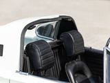 a close up of a white car with black leather seats