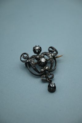 an image of a close up of a black and white broochle