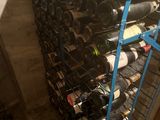 many bottles of wine on a rack in a room