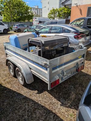 a silver truck with a metal bed parked in a parking lot