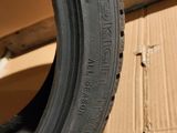 tires are stacked on a cardboard box in front of a cardboard box