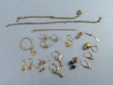 a lot of jewelry that is laying out on the table