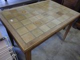 a table with a glass top and a tile pattern on it