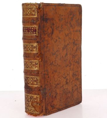an old book sitting on top of a table next to a white background