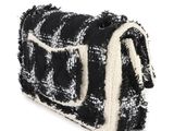 black and white checkered purse on a white background