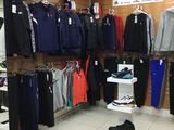 a lot of clothes on display in a store