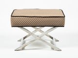 an upholstered foot stool with a cushion on top of it