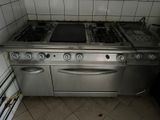 an image of a kitchen with two stoves and a dishwasher