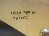 a close up of a yellow boat with a name on it
