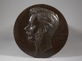 bronze medal of a man with a beard on a white background