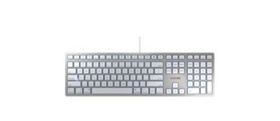 un clavier d'ordinateur posé sur une surface blanche