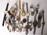 a lot of watches that are sitting on a table