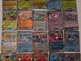 a bunch of pokemon cards sitting on top of a table