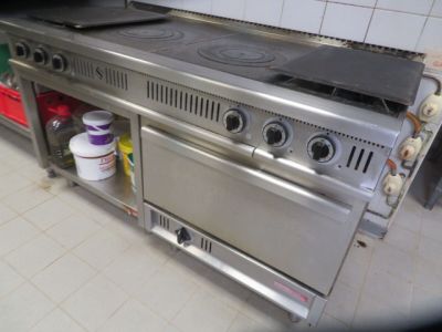an image of a kitchen with a stove and a stove top
