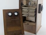a small wooden box with a drawer inside of it