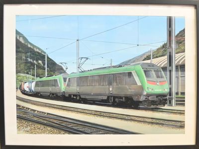 une photo d'un train vert et blanc sur les rails