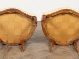 pair of mid century style chairs with woven seats on wooden legs