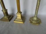 three candles that are sitting next to each other on a table