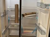 a refrigerator that is open with the door open