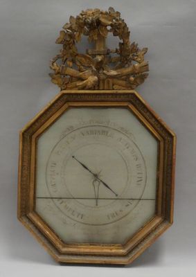 a gold clock with a clock face on it