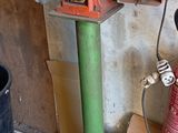many different types of gas cans and other items in a garage