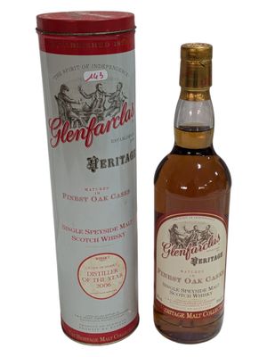 an image of a bottle of whisky next to a canister