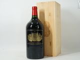 a bottle of wine sitting next to a wooden box