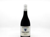 a bottle of wine that is sitting on a table