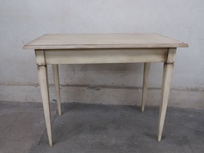 a small table that is sitting on the concrete floor