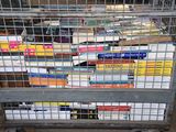 a cart full of books sitting on the floor